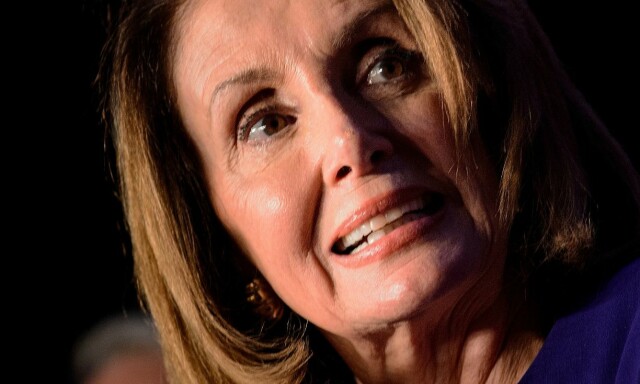 Surrounded by supporters House Minority Leader Nancy Pelosi (D-CA) celebrates a projected Democratic Party takeover of the House of Representatives during a midterm election night party hosted by the Democratic Congressional Campaign Committee on November 6, 2018 in Washington, DC. - Democrats seized control of the lower house of Congress in midterm elections on November 6, 2018, dealing a stern rebuke to Donald Trump almost two years into his polarizing, rollercoaster presidency. Fox and NBC television networks called the result in the US House of Representatives, while confirming expectations that Trump's Republicans will retain control of the Senate. (Photo by Brendan Smialowski / AFP)